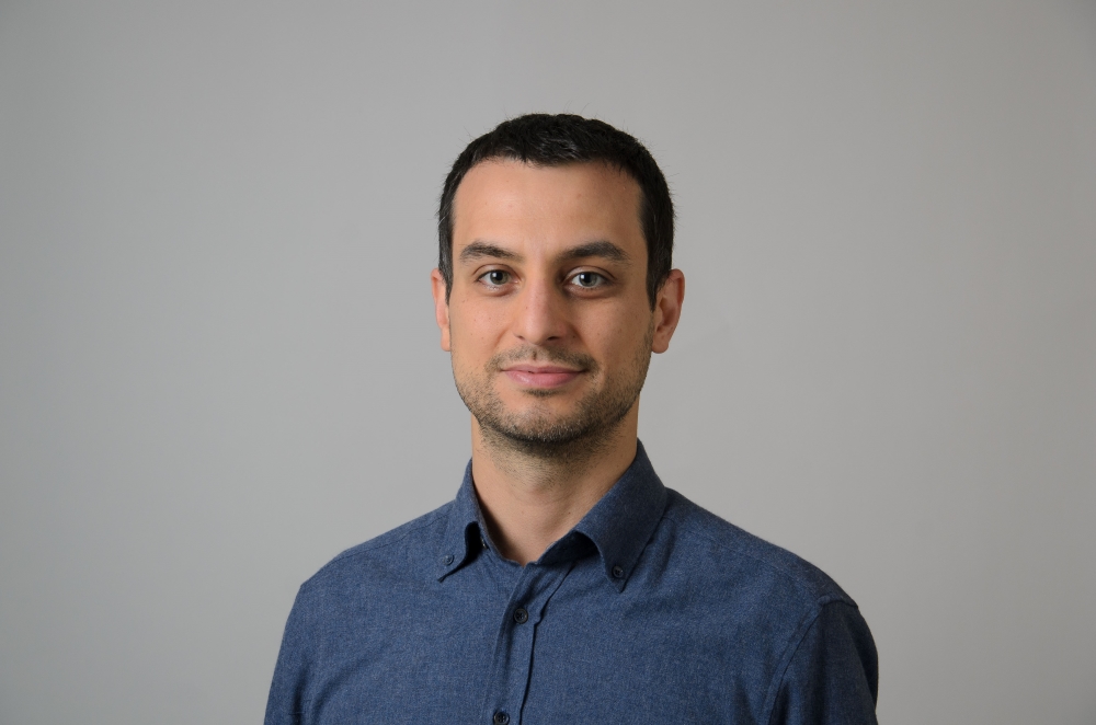 Portrait of Salih Emre Gercek wearing a blue collared shirt