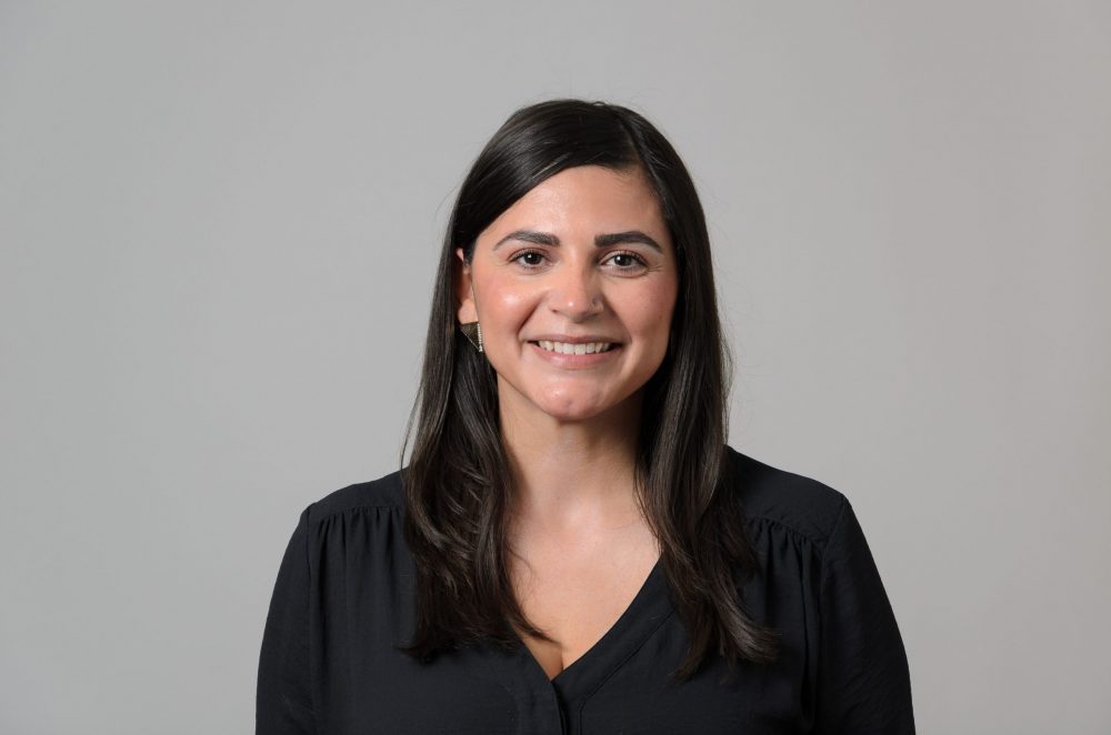 Portrait of Joanna Rivera Davis wearing a black blouse