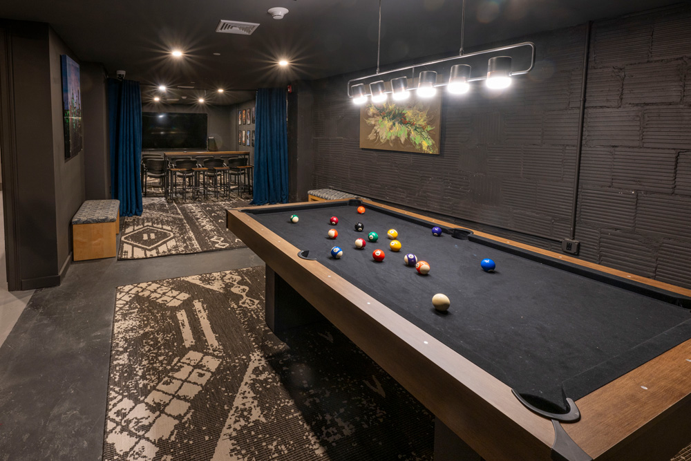 Empty game room with billards table.
